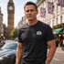 Man in London standing next to Aston Martin wearing JAMES BOND T-Shirt