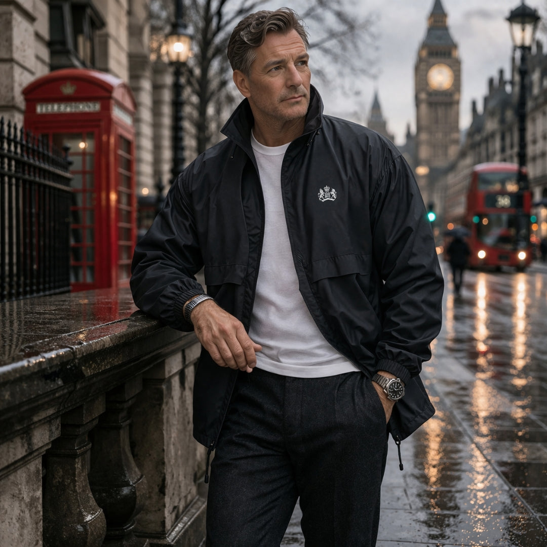 Man in Navy jacket standing on a rain-soaked street with iconic London landmarks in the background