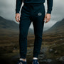 Man wearing James Bond Skyfall Joggers with S.I.S. Logo at Skyfall Photo spot in Scotland