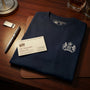 James Bond T-Shirt with Embroidered S.I.S. Logo from Skyfall Closeup on desk with Vesper's business card