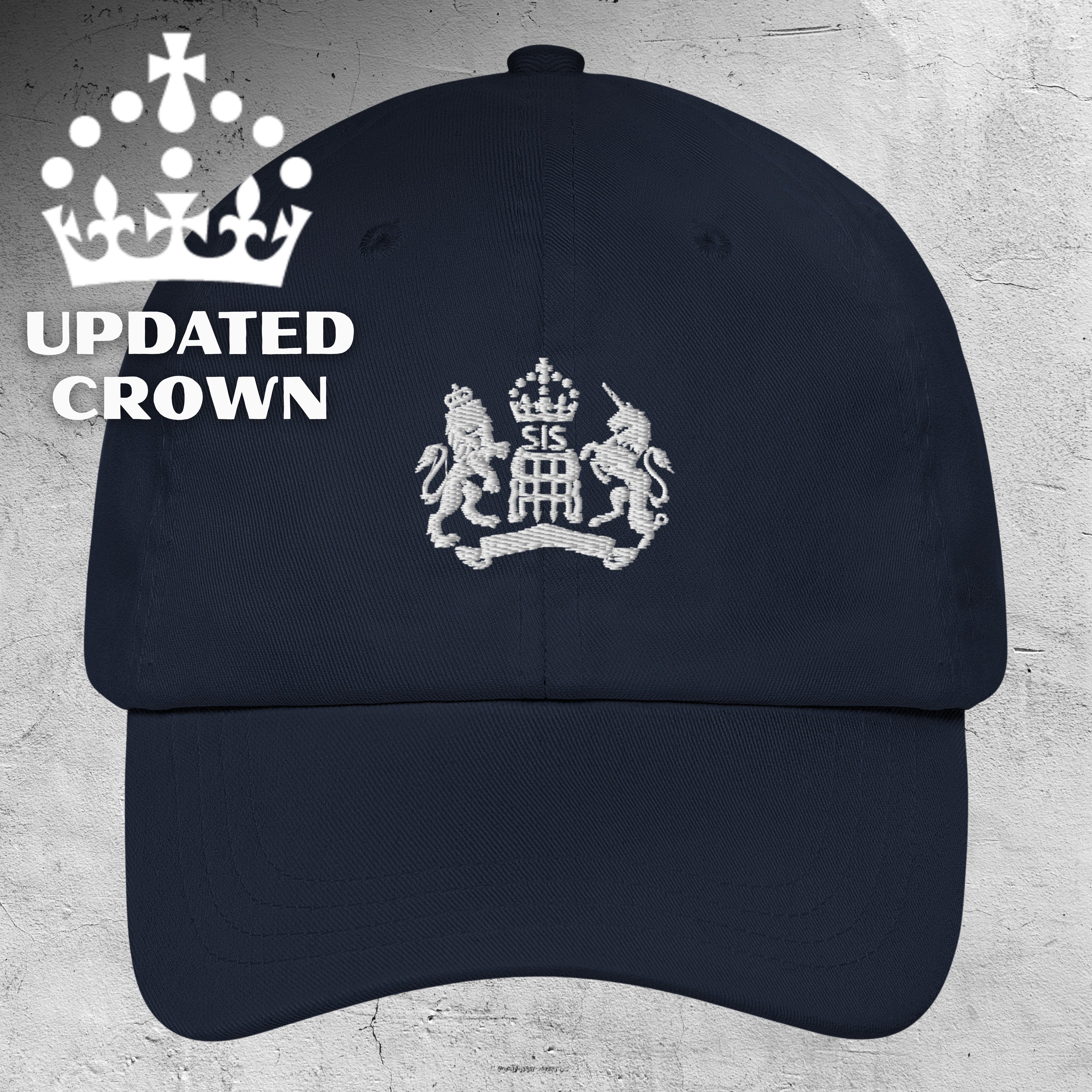Navy cap with white emblem and 'Updated UK Kings Crown' text on a light gray background